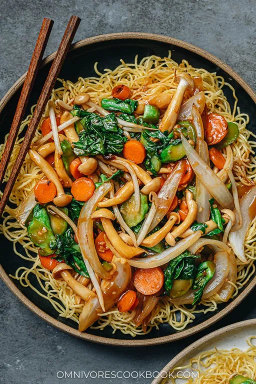 freshly baked Vegetable Fried Noodles in a pan with chopsticks