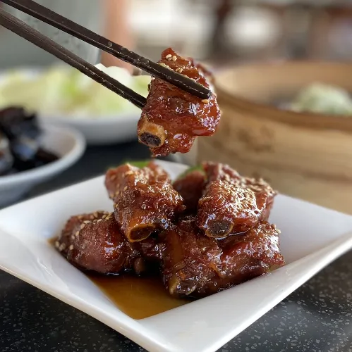 Delicious poork ribs in chopsticks