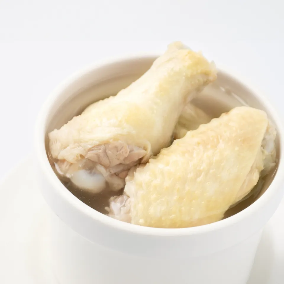 ready to serve chicken soup with bones in the bowl