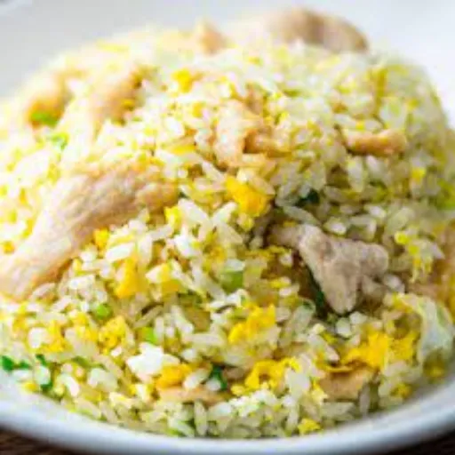 Closeup of Chicken Fried Rice with the chicken chunks are visible