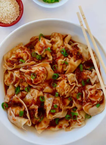 Chicken Spicy Wontons ready to server with the chillies on the top looks yummy and spicy