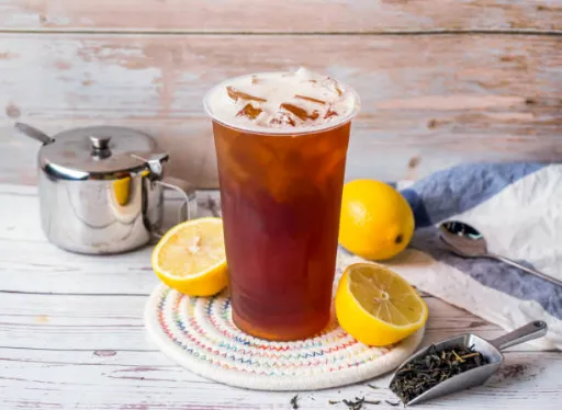 Iced Black Tea ready to serve placed with lemons