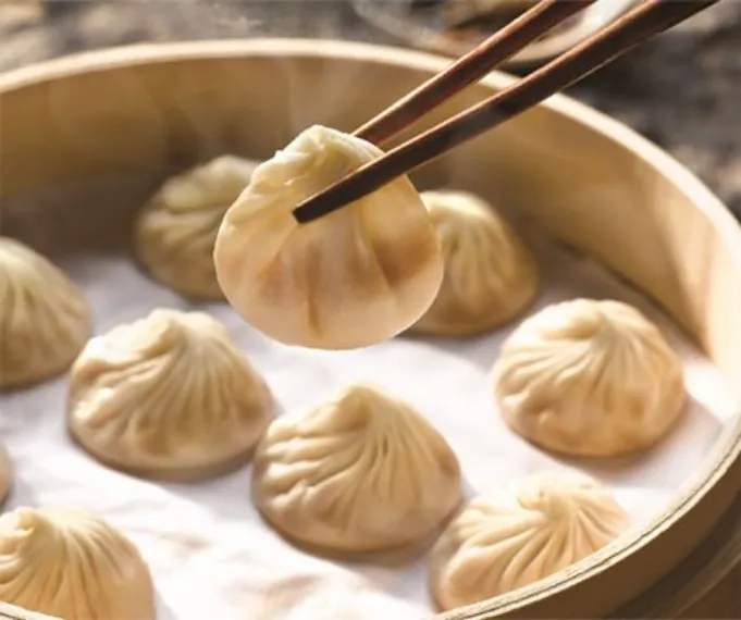 Ready to eat dumpling on chopstick