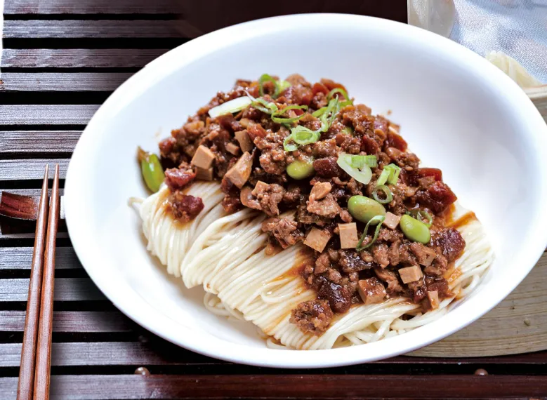 top view of Minced Kurobuta Pork Noodles with the garnishing on it