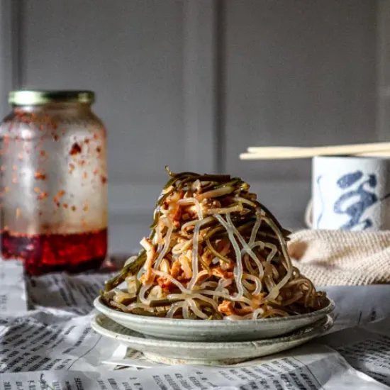 pile of Seaweed Salad with the sauce jar at the back looks so yummy and good