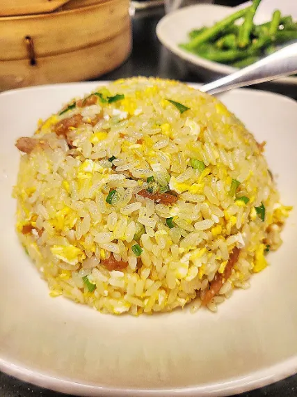 top view of Shredded Kurobuta Pork Fried Rice with spoon placed in plate