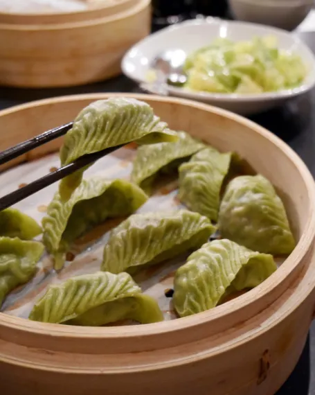 Vegan Dumplings picked by chopstick for eatnig