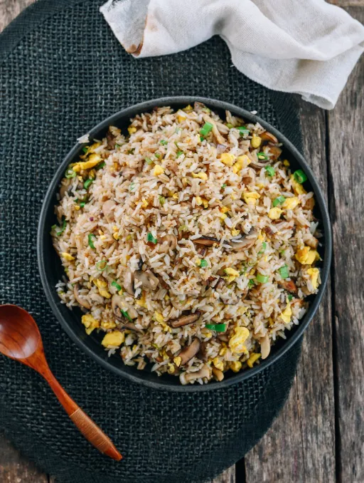 Frshly baked Vegetable & Mushroom Fried Rice placed in pan for serving 