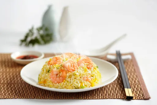 ide vide of Shrimp Fried Rice with the chopsitcks on the table